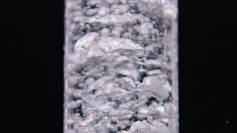 Water bubbling in a container Stockbeeldmateriaal 251841658