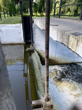 Water is bubbling at the lock of a small river Stock Photos