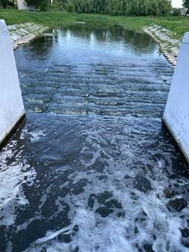 Water is bubbling at the lock of a small river Stock Photos