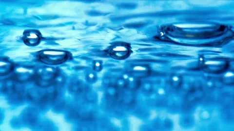 Water bubbling or boiling in clear glass. Stock Footage 255090144