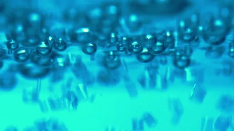 Water bubbling or boiling in clear glass. Stock Footage 255090149