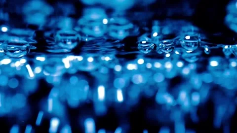 Water bubbling or boiling in clear glass. Video stock 255090794