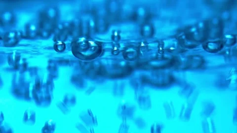 Water bubbling or boiling in clear glass. Video stock 255092185