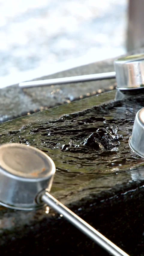 Water Bubbling in a Stone Temizuya Basin at Oyama Shrine Stock Footage 333300800