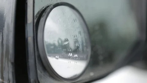 Water on a car side mirror Stock Footage 90822408