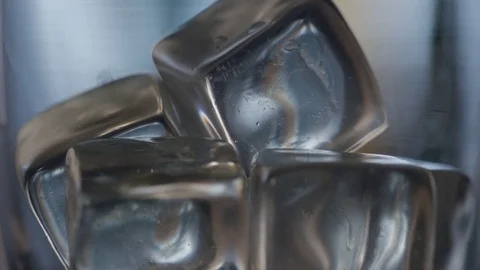 Water Cascades Down Over Ice Cubes Stock Footage 76415742