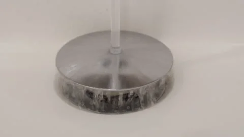 Water Cascades into Sink Drain, Emphasizing Essential Plumbing Function. 스톡 동영상 318673013