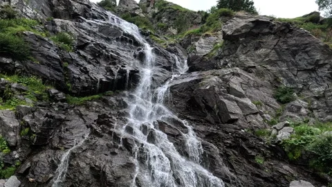 Water cascading down mountain rocks Stock Footage 304758070