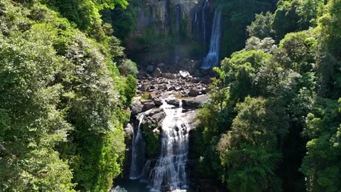 Water cascading down rocks at nauyaca falls in costa rica Stock Footage 339119076