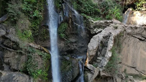 Water Cascading Down a Rocky Tropical Waterfall in Chiang Mai, Thailand Stock Footage 335569472