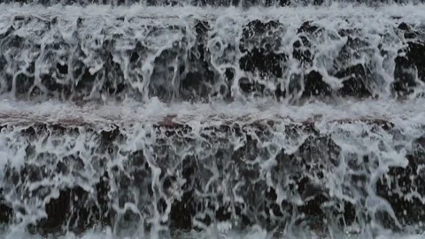 Water cascading down steps or ledges in close up Stock Footage 152752796