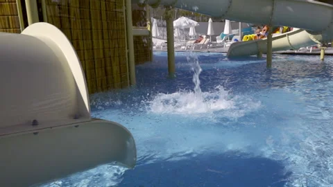 Water cascading down off a water slide at a fairground Stock Footage 203951484