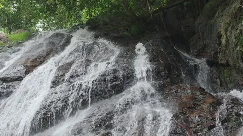 Water Cascading Over Dark Rocks in Tropical Rainforest. Koh Samui. Thailand. Stock-Footage 341652379
