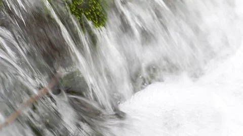 Water cascading over moss-covered rocks. Stock Footage 288831150