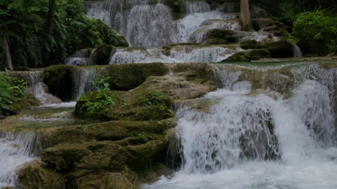 Water Cascading Over Mossy Limestone Rocks At Huai Mae Khamin Waterfall Kan.. Stock Footage 340183141