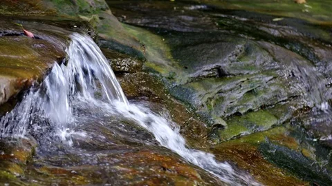 Water Cascading Over Rocks Stock Footage 74644048