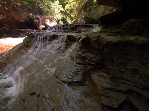 Water Cascading over shale riverbed in Cuyahoga Valley National Park Stock Footage 77158946