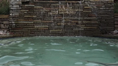 Water cascading into pool 스톡 동영상 76256638