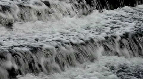 Water cascading in a river Stock Footage 10300289