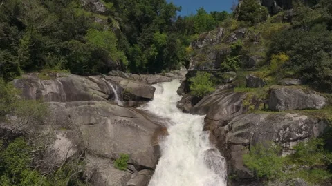Water Cascading On Rocks, Waterfall - Drone Shot Stock Footage 313933034