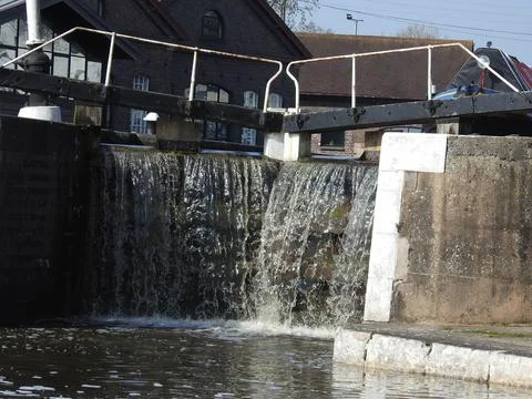 Water cascading through lock Stock Photos