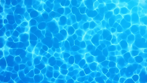 Water caustic backgoround. Pure, clean blue water in the pool. Seamless Loop Stock Footage 113230911
