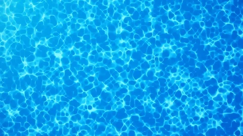 Water caustic backgoround. Pure, clean blue water in the pool. Seamless Loop Stock Footage 113231461