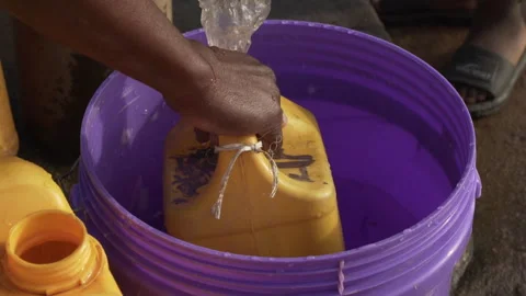Water collection at water pump Stock Footage 250015954