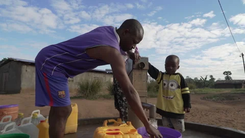 Water collection at water pump Stock Footage 250016685