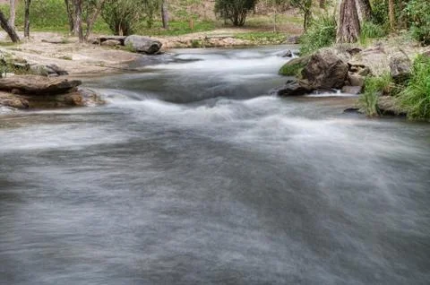 Water coming down a river Stock Photos