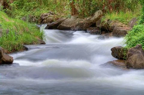 Water coming down a river Stock Photos