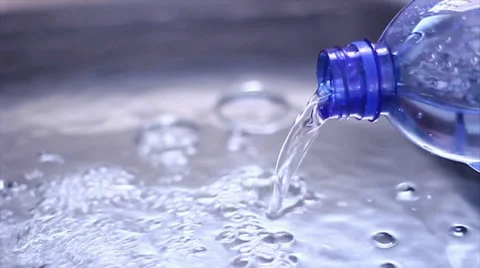 Water coming out of the bottle, slow motion Stock Footage 34394802