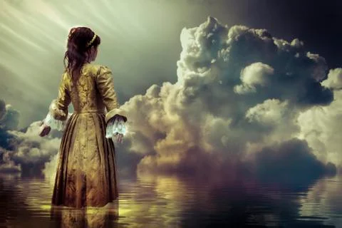 Water concept. a sky of clouds reflected in a calm sea. Stock Photos