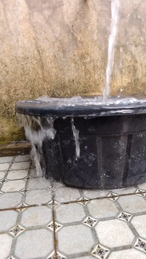 Water continuously pouring into and overflowing Stock Footage 333249577