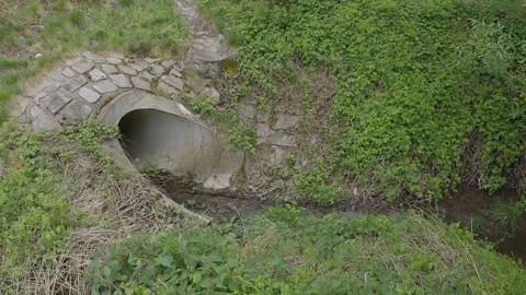 Water coulvert under train tracks. Water drain, drain pipe. 4K video Video stock 273906180