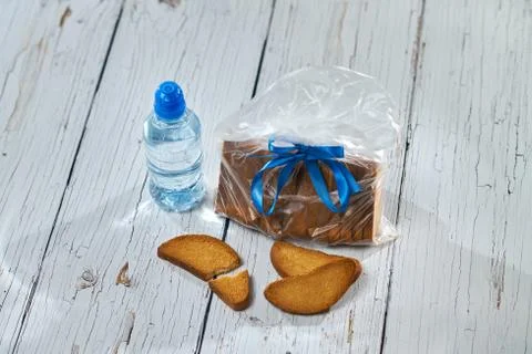 Water, crackers and drying on the background of boards. Stock Photos