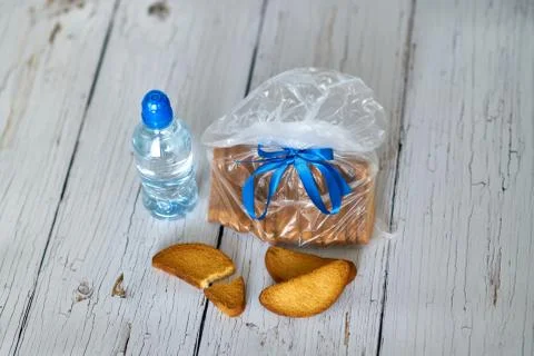 Water, crackers and drying on the background of boards. Stock Photos