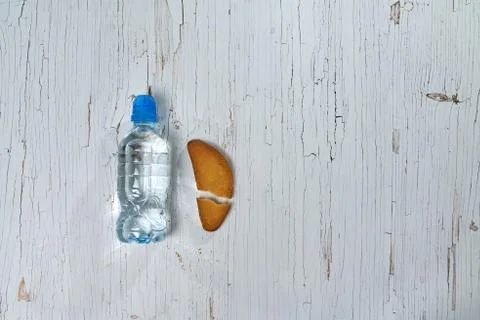 Water, crackers and drying on the background of boards. Stock Photos