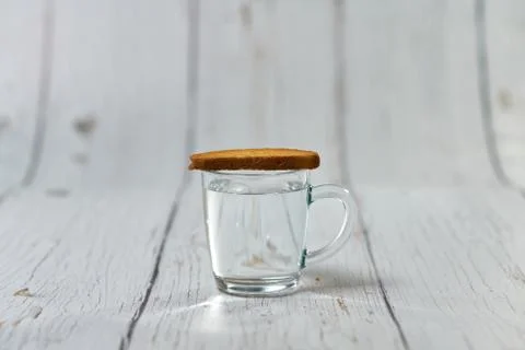Water, crackers and drying on the background of boards. Stock Photos