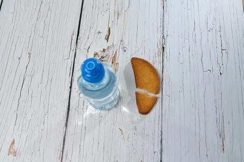 Water, crackers and drying on the background of boards. Stock Photos
