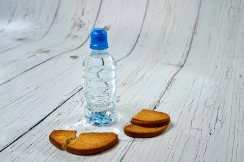 Water, crackers and drying on the background of boards. Stock Photos