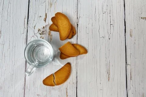 Water, crackers and drying on the background of boards. Stock Photos