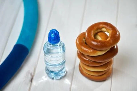 Water, crackers and drying on the background of boards. Stock Photos