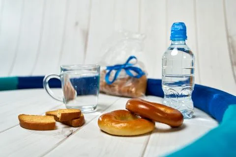 Water, crackers and drying on the background of boards. Stock Photos