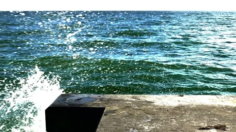 Water crashes up on concrete dock, 4K Stock Footage 54089229