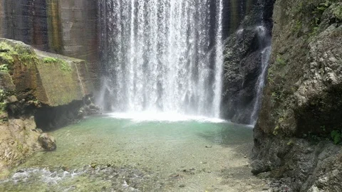 Water crashes down from high waterfall in rural Jamaica Stock Footage 125094931