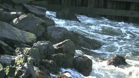 Water crashes on rocks Stock Footage 694082