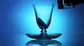Water cup with ice. Blue background HD Footage