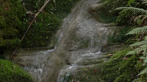 Water current flowing over rocks Stock Footage 328914765