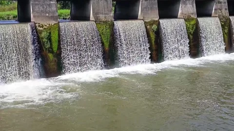 Water dam with flowing water through gate Stock Footage 305919136